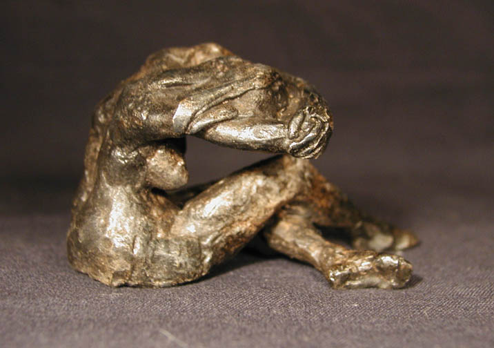 female_solemn_seatedhead_in_arms_right.jpg (57645 bytes)