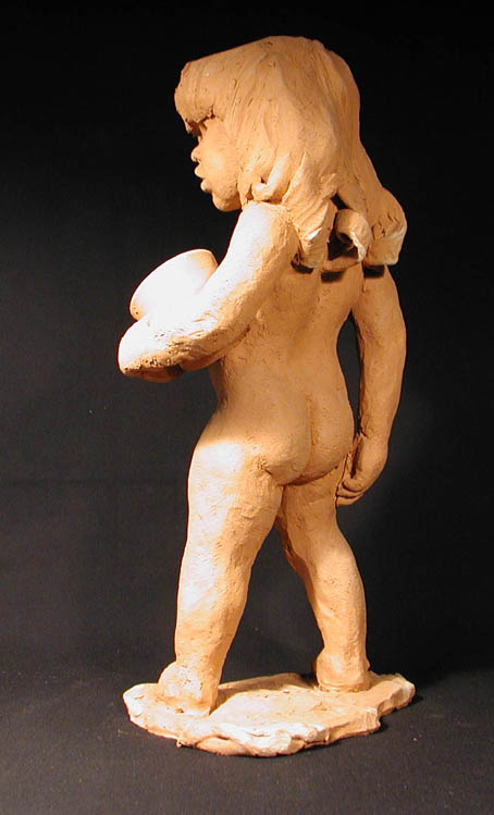 child_with_pail_back.jpg (51140 bytes)